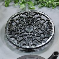 Black Heavy Duty Cast Iron Round Trivet in Situ in the home