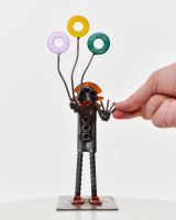 Tuppence the Clown Upcycled Metal Ornament with hand in shot for scale Tuppence the Clown Upcycled Metal Ornament with hand in shot for scale