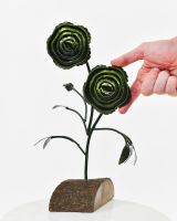 Twin bloom Upcycled Steel Botanical Sculpture in Wooden Base -Green with hand in shot for scale Twin bloom Upcycled Steel Botanical Sculpture in Wooden Base -Green with hand in shot for scale