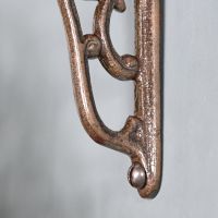 Close up of bracket with pre-drilled screw hole 