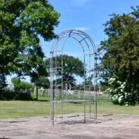 Antique Grey Arbour with Oval Seat in Garden Setting