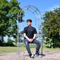 Male sat within Antique Grey Arbour 