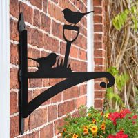 Robin on Garden Shovel Hanging Basket Bracket in Situ on a Brick Wall Robin on Garden Shovel Hanging Basket Bracket in Situ on a Brick Wall