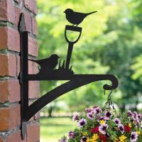 Robin on Garden Shovel Hanging Basket Bracket in Garden Robin on Garden Shovel Hanging Basket Bracket in Garden