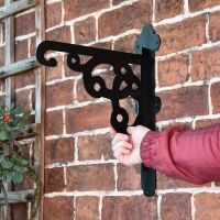 Ornate Hanging Bracket mounted to wall 