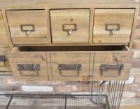 Close up of three compartments and one drawer 