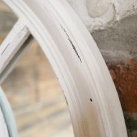 Close up of Aged White Arched Mirror Frame 