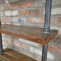 Close up of wooden shelf and pipe