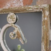 Close up of rustic cream finish and embellishments 