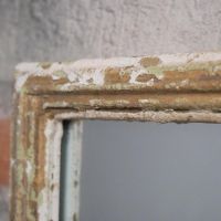 Close up of rustic cream finish on framework 