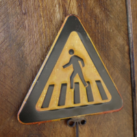 Close up of Black & Yellow Triangle Pedestrian Sign & Hook 