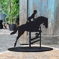 Showjumping Horse Iron Door Stop Next to a Rustic Blue Door Showjumping Horse Iron Door Stop Next to a Rustic Blue Door