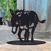 Donkey Iron Door Stop Next to a Rustic Blue Door Donkey Iron Door Stop Next to a Rustic Blue Door