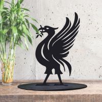 Black Liver Bird Silhouette Ornament in Side in the Conservatory 