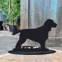 Cocker Spaniel Door Stop Next to a Rustic Blue Door