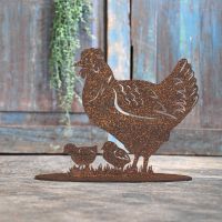 Hen & Chicks Rustic Iron Door Stop in Front of a Rustic Blue Door Hen & Chicks Rustic Iron Door Stop in Front of a Rustic Blue Door