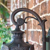 Close up of swan neck bracket with decorative detailing 