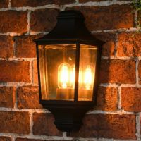 Digital illustration of illuminated "Brooksby" Traditional Black Flush Half Wall Lantern