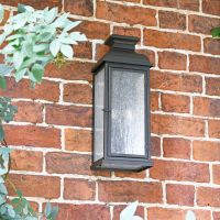 Traditional Aged Copper Wall Lantern on Brick Wall Traditional Aged Copper Wall Lantern on Brick Wall