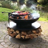 Ring Fire Bowl With Log Store Cooking Food in the Garden Ring Fire Bowl With Log Store Cooking Food in the Garden