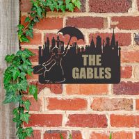 Mary Poppins Iron House Name Sign in Use on a Brick Wall