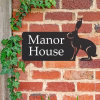 Hare House Name Sign on Brick Wall  Hare House Name Sign on Brick Wall