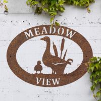 Goose & Gosling Iron Oval House Sign in Use Outdoors Goose & Gosling Iron Oval House Sign in Use Outdoors