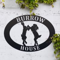 Boxing Hares Iron Oval House Sign in Use Outdoors