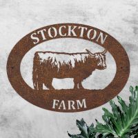 Highland Cow Iron Oval House Sign in Use Outdoors Highland Cow Iron Oval House Sign in Use Outdoors