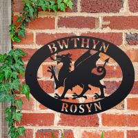Welsh Dragon Iron Oval House Sign on a Brick Wall