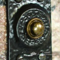 Close-up of the Black Finish on the Traditional Rectangular Door Bell Push