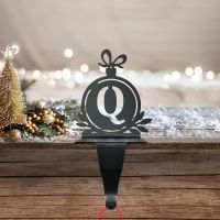 Letter Q Stocking Holder in Situ on a Mantel Piece Letter Q Stocking Holder in Situ on a Mantel Piece