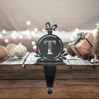 Letter T Stocking Holder in Situ on a Mantel Piece 