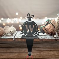 Letter W Stocking Holder in Situ on a Mantel Piece 
