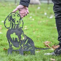 Unfinished Metal Dachshund Silhouette with hand for scale Unfinished Metal Dachshund Silhouette with hand for scale