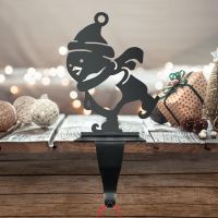 Black Stocking Holder with Penguin on Skates Black Stocking Holder with Penguin on Skates