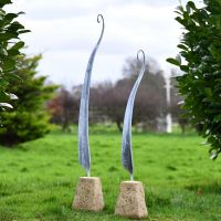 Fern Sculptures Finished in a Rustic Steel in Situ in the Garden