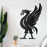 Liver Bird Wall Art on the Wall Next to Plants Liver Bird Wall Art on the Wall Next to Plants