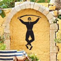 Harlequin Steel Wall Art in Situ on a Yellow Wall