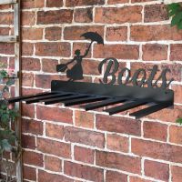 Wall Mounted Liver Bird Iron Boot Holder Mounted on a Brick Wall Wall Mounted Liver Bird Iron Boot Holder Mounted on a Brick Wall
