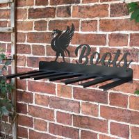 Wall Mounted Liver Bird Iron Boot Holder Mounted on a Brick Wall