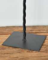 Close up of freestanding base detail on union jack skull ornament Close up of freestanding base detail on union jack skull ornament