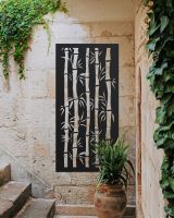 Black "Bamboo Garden Wall Art" on a brick wall next to stairs Black "Bamboo Garden Wall Art" on a brick wall next to stairs