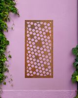 Rustic" Honeycomb Pattern Wall Art" on a purple garden wall  Rustic" Honeycomb Pattern Wall Art" on a purple garden wall