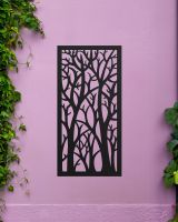 "Black Autumnal Trees Garden Wall Screen" on a purple garden wall