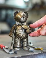 Scale image of recycled metal bear sculpture