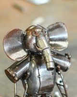 Close up of face detail on elephant on crutches sculpture