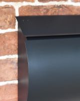 Close-Up of Matte Black Finish on Wall-Mounted Post Box Close-Up of Matte Black Finish on Wall-Mounted Post Box