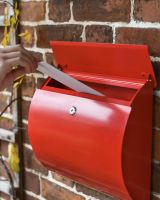 Letter Aperture in Use on Wall-Mounted Post Box