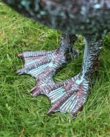 Verdigris Swan Facing Down close up of feet